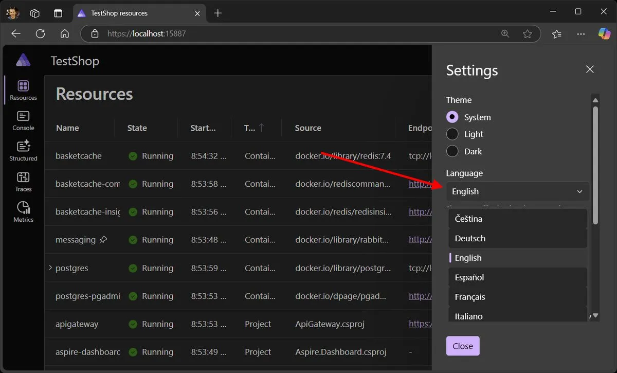 A screenshot of the Aspire dashboard showing the new flyout menu to change language
